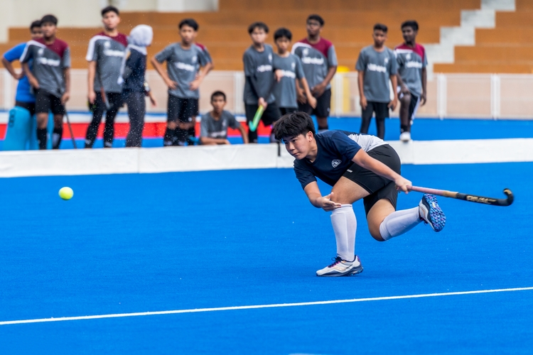 st hilda's player taking a shot 