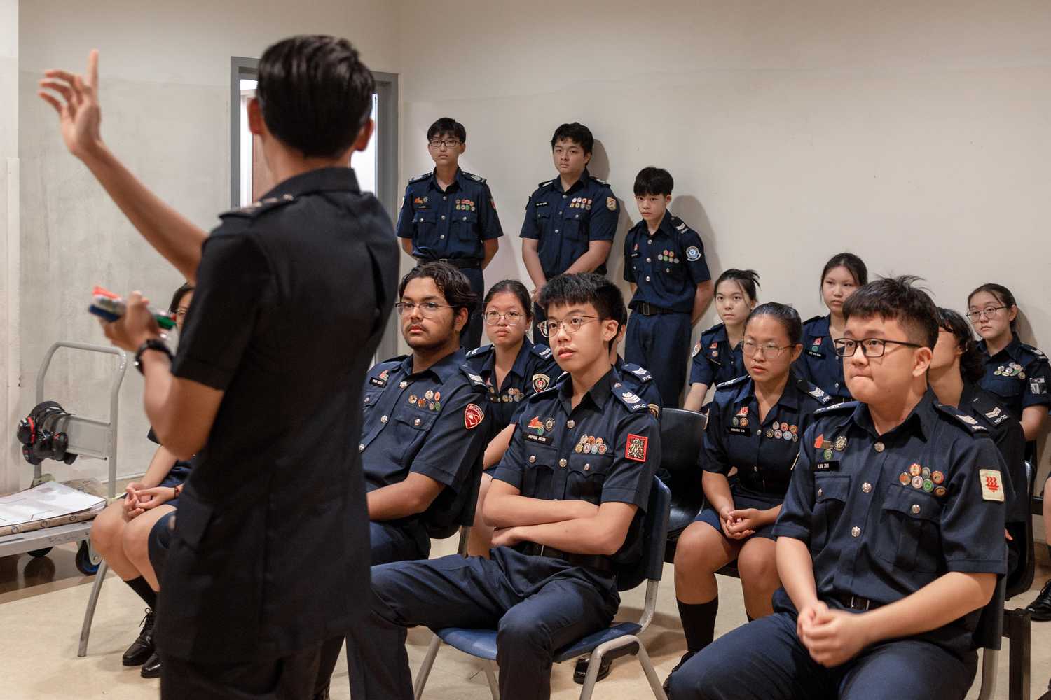Cadet Inspector explaining instructions to NPCC Cadets, Cadets are listening intently. 