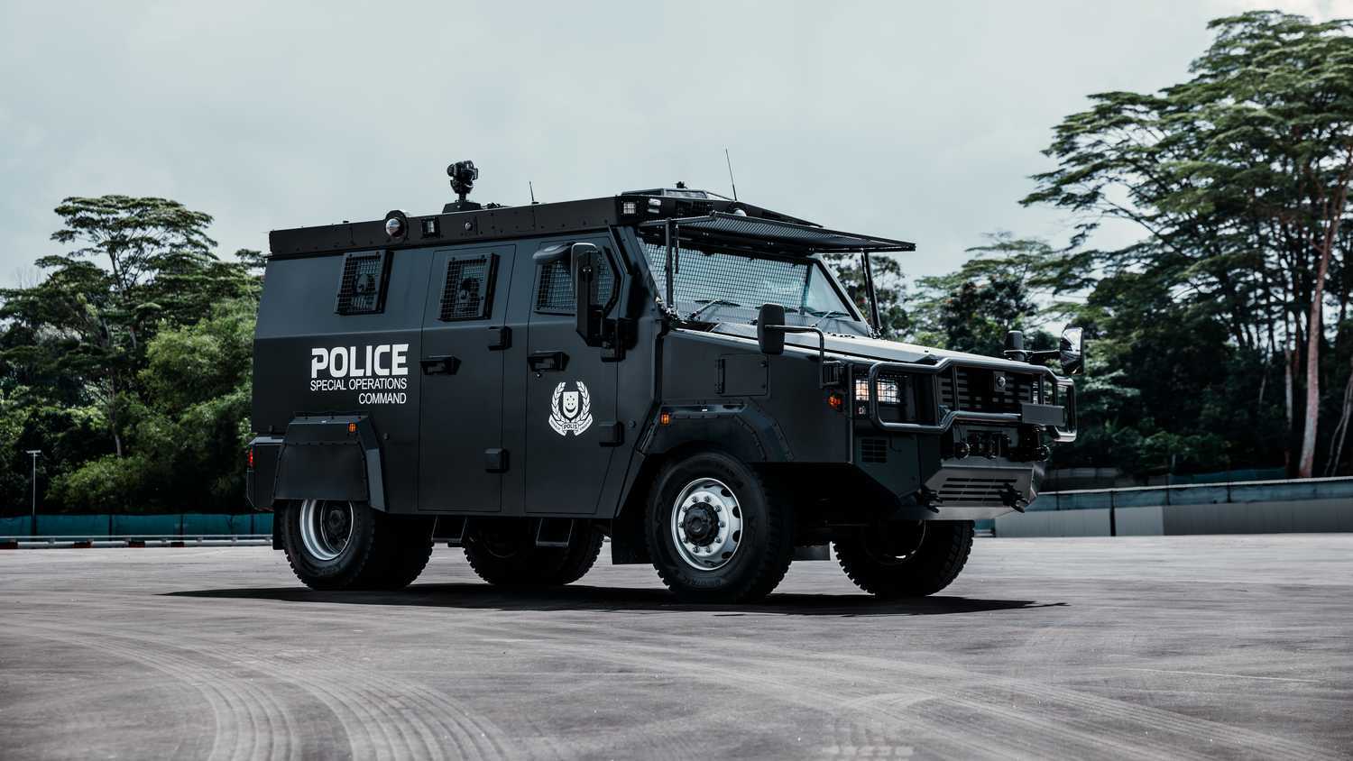 SPF's latest addition to the Special Operations Command arsenal, the Tactical Strike Vehicle. It's black in color and has the word "Police Special Operations Command" on its side with the SPF logo in white.