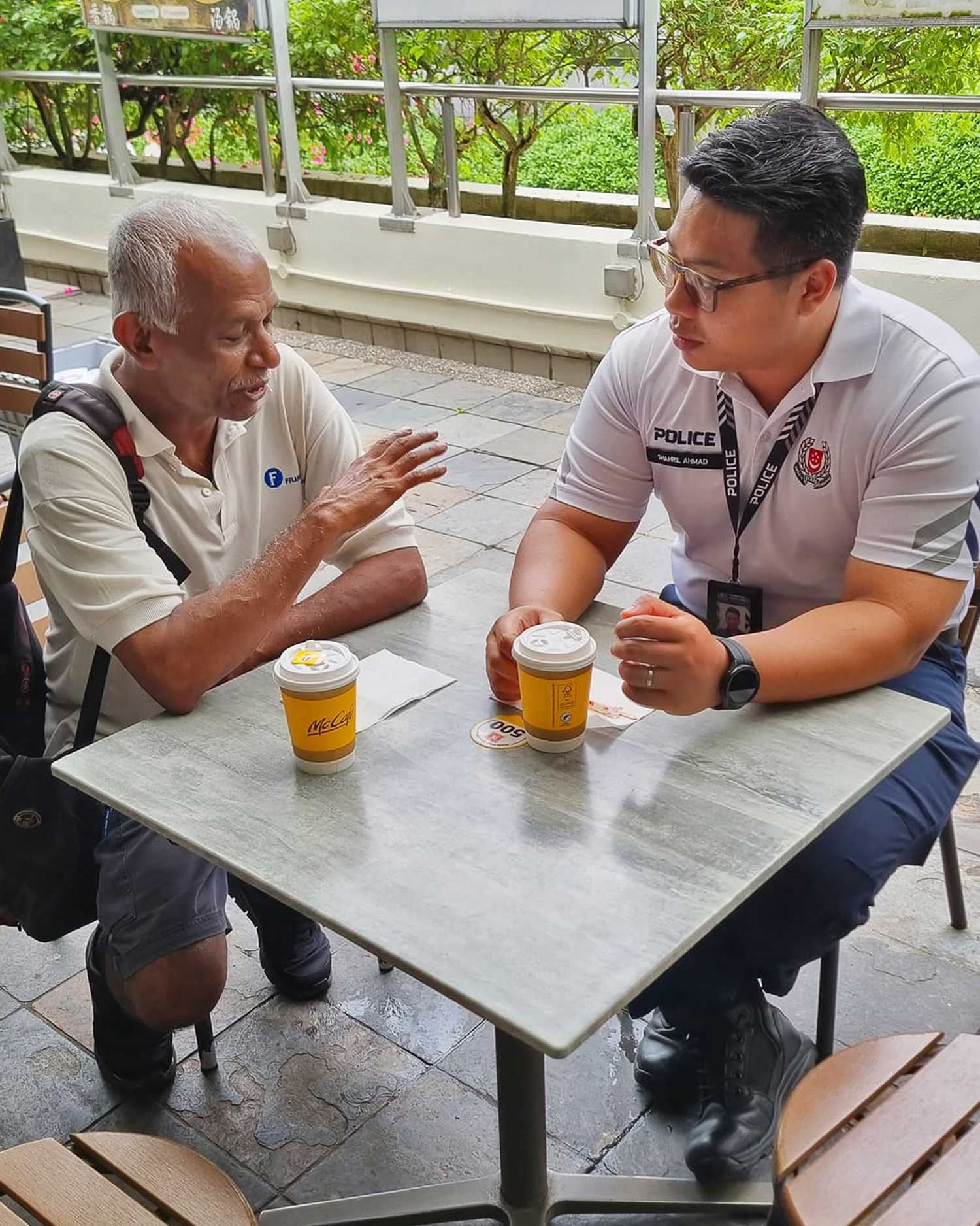 Officers from Toa Payoh NPC chatting with elderly during the session.