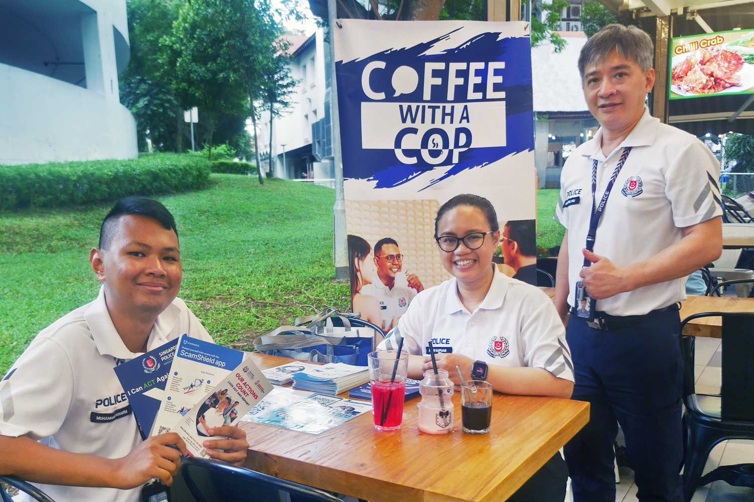 3 friendly CPU officers from Bukit Batok NPC looking at the camera and smiling.