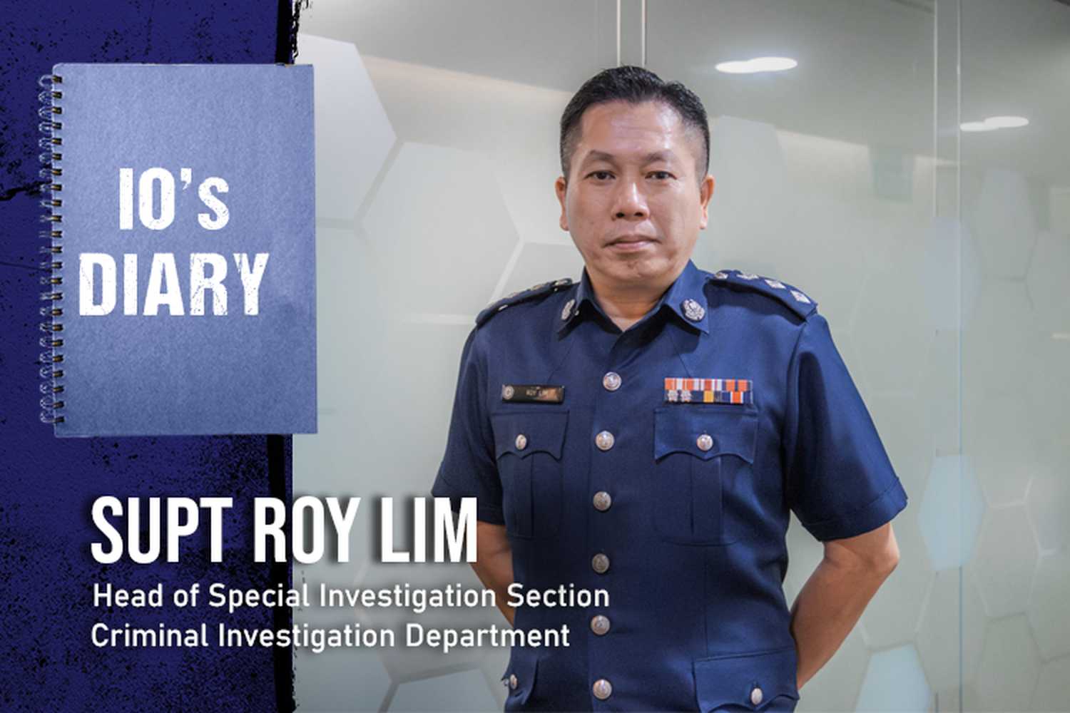 Superintendent of Police (Supt) Roy Lim in a close-up profile shot of the cover photo of the IO's diary series, where his name is shown on screen, along with the words 'Head of Special Investigation Section' and 'Criminal Investigation Department'. He is in uniform.