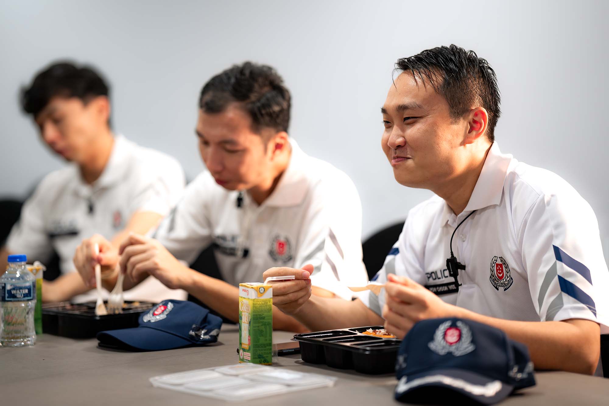 three officers eating their bento lunches together