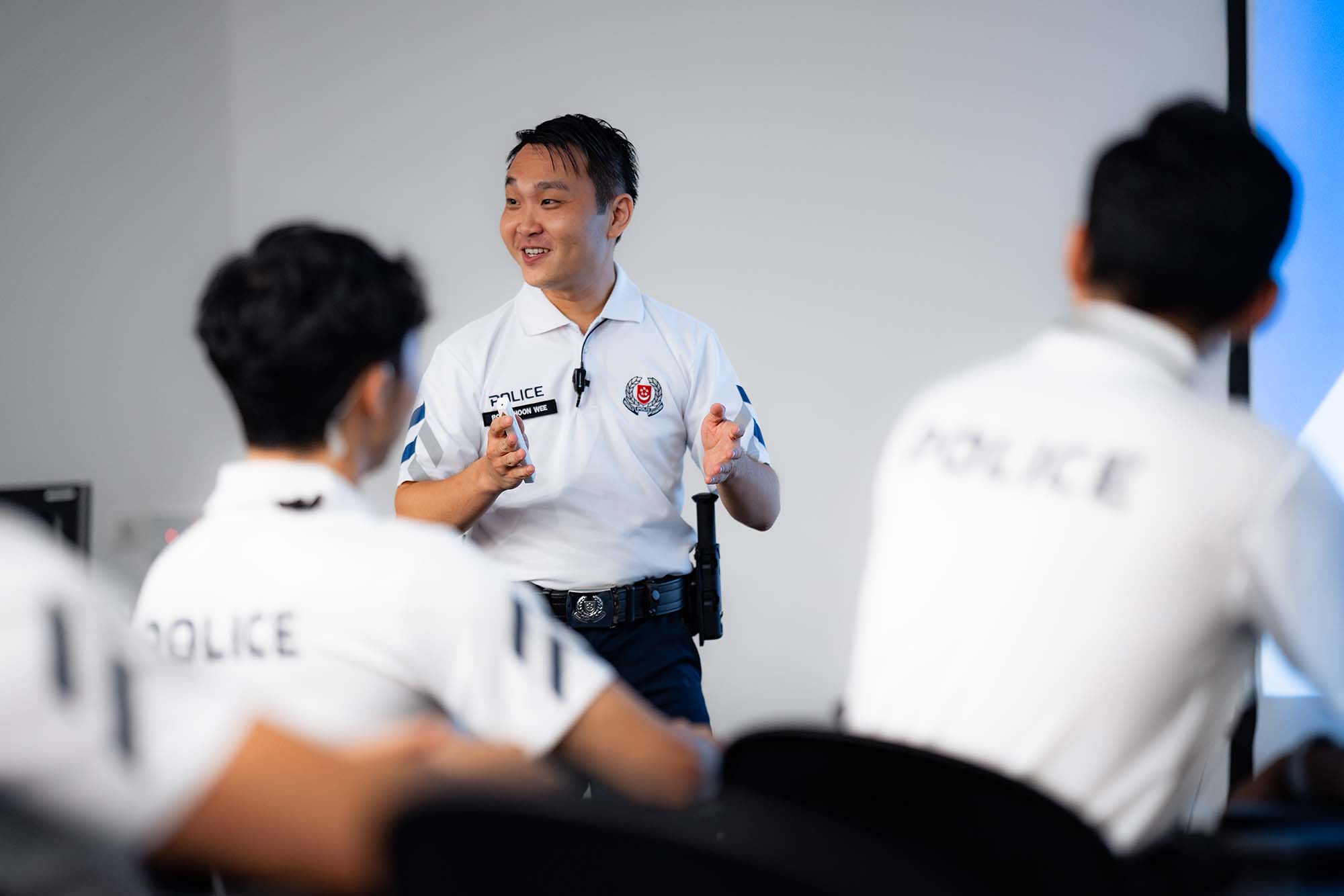 cpu officer giving a briefing in a room infront of other cpu officers