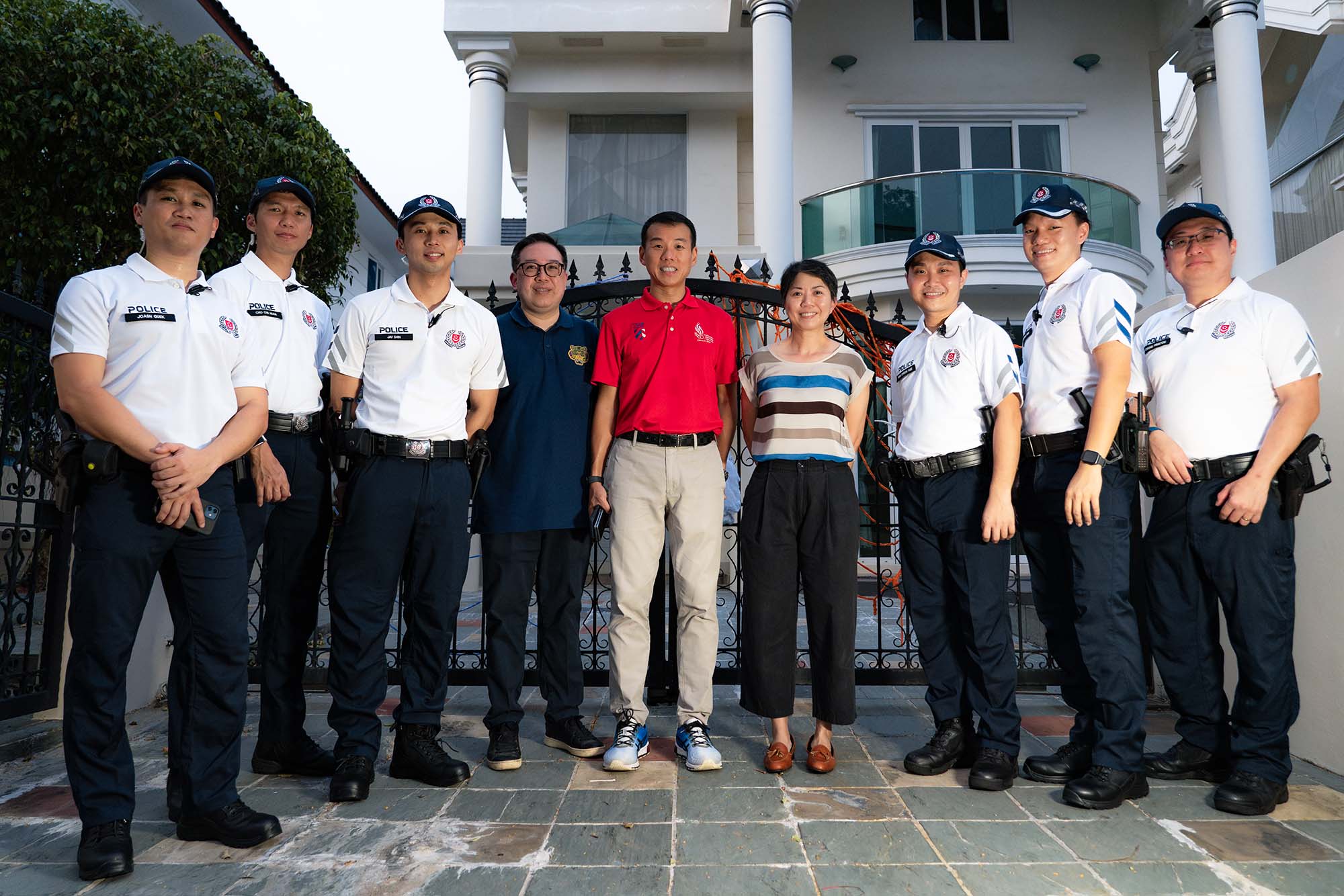 cpu officers standing together with commander and deputy commander. Commander is wearing a red polo tee while deputy commander is wearing a striped coloured top