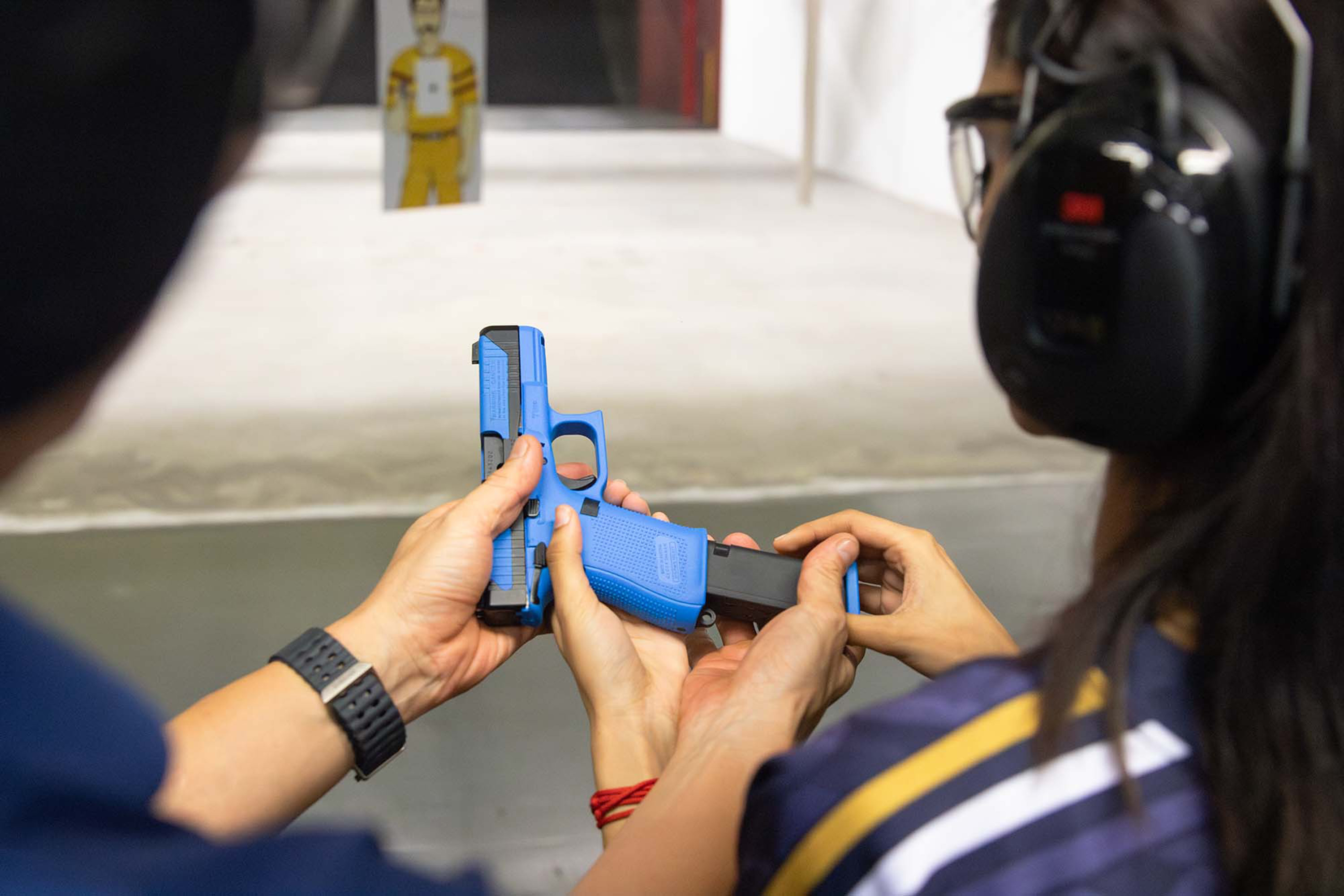 With the help of my trainer, I gained a deeper understanding of how to use a pistol. PHOTO: Shavina Sri