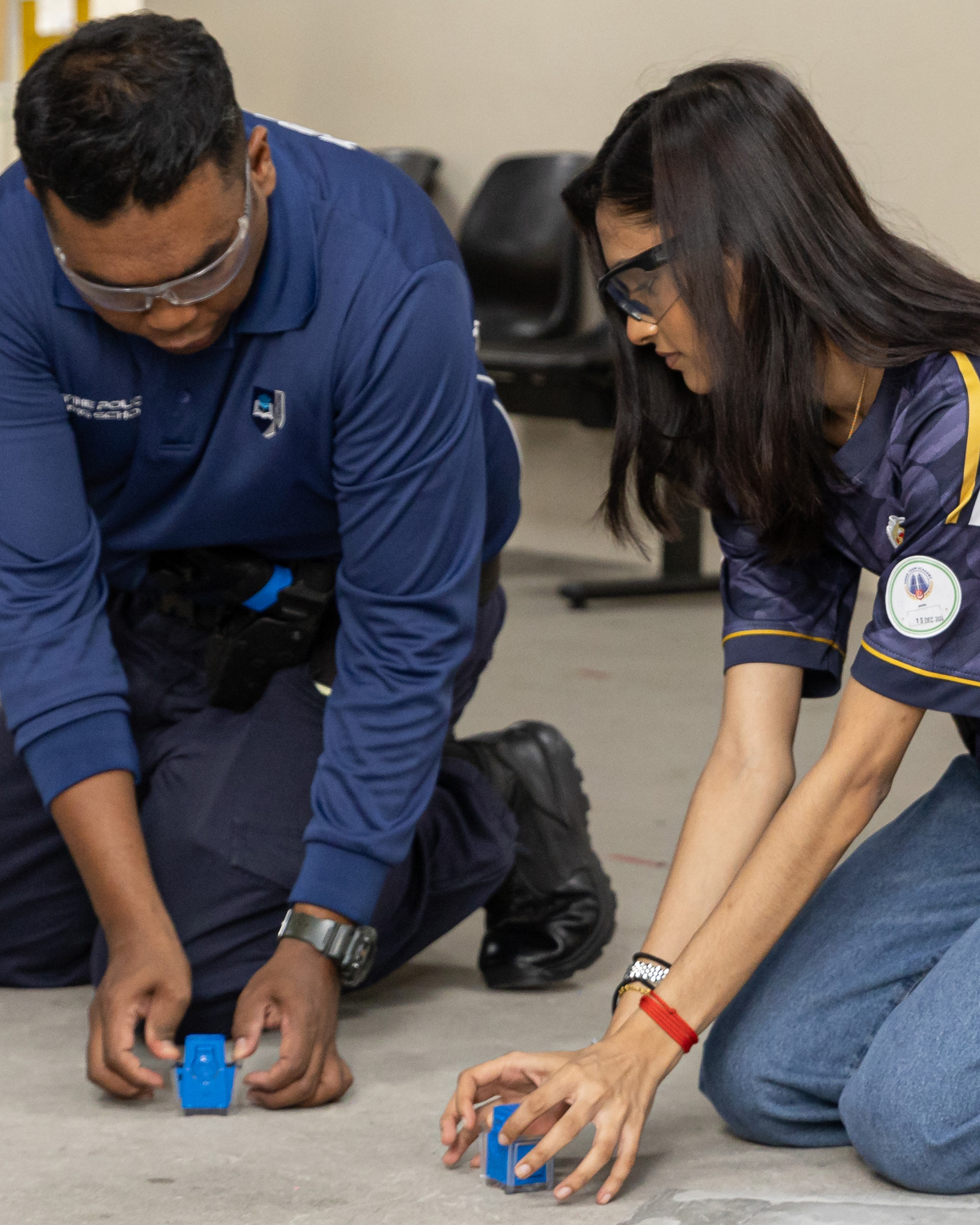 Opening the cartridge that contains the taser probes. PHOTO: SC Javier Tay