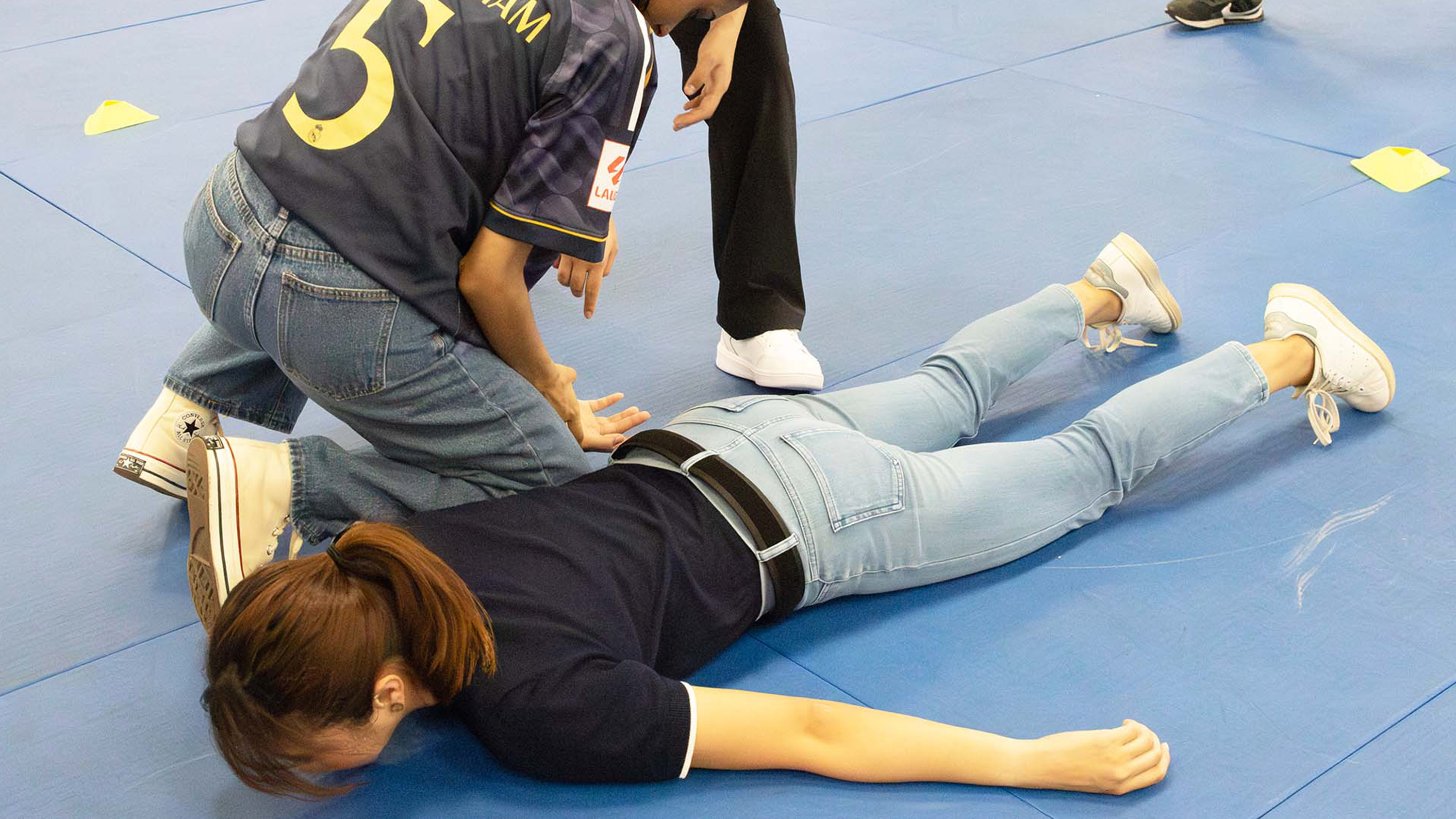 Practicing how to take down an assailant with the help of the trainer. PHOTO: Shavina Sri